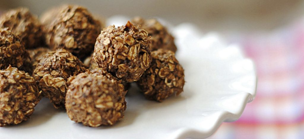 Chocolate peanut butter balls made with powdered peanut butter. 